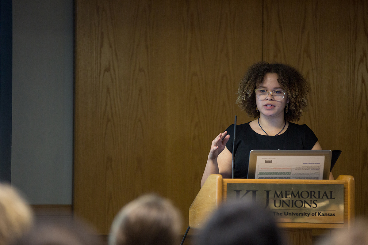 A student speaks to a crowd