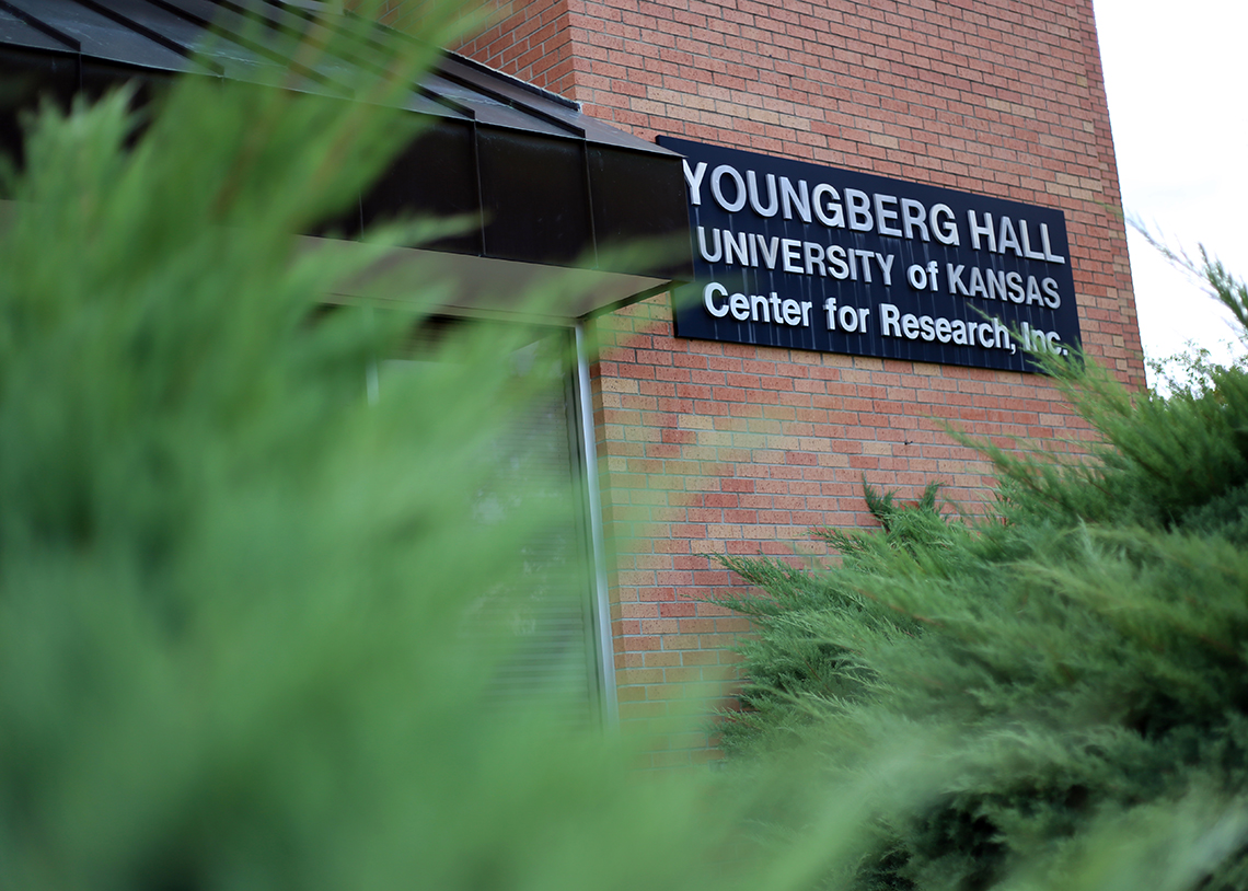 Facade of Youngberg Hall showing sign with name of building and the words "University of Kansas Center for Research, Inc."